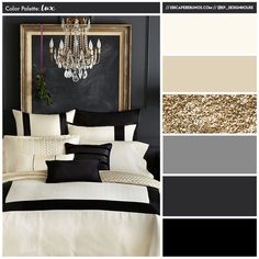 a bedroom with black and white bedding, chandelier and gold accents on the wall