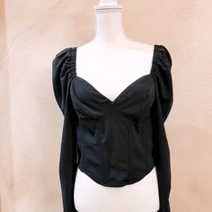 Betty Top Features A Statement Sweetheart Neckline That Leads To A Structured, Corset Bodice. Side Zip Closure Sweetheart Neck Long Puffy Sleeves 93% Polyester, 7% Elastane Black Tops With Sweetheart Neckline For Party, Black Party Top With Sweetheart Neckline, Black Sweetheart Neckline Top For Party, Chic Cotton Top With Sweetheart Neckline, Black Fitted Top With Sweetheart Neckline, Long Sleeve Cotton Crop Top For Night Out, Spring Black Tops With Sweetheart Neckline, Trendy Tops With Sweetheart Neckline For Night Out, Black Balloon Sleeve Top For Party