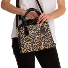 "Step out in style with this snazzy leopard print bag that is durable. Great for work, church, or dinner with your special someone. It has a single zippered top closure. Inside has a deep main compartment, a zippered pocket, and two side pockets that can be used for holding your phone, cosmetics, etc. The adjustable fabric shoulder strap is removable, so it can double as a stylish handbag -- perfect for any  occasion. Length = 9\" Height = 8\" Width = 3.5 Shoulder strap length = 49.5\" Handle length = 12.5\"" Leopard Print Bag, Unique Handbag, Dalmatian Dog, Stylish Purse, Printed Purse, Purse For Women, Printed Handbags, Black Handle, Shoulder Handbag