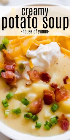 creamy potato soup in a white bowl topped with sour cream and bacon