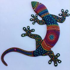 a colorful gecko painted on the side of a wall