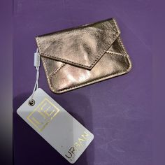 Urban Expressions Small Card Wallet Gold New Withdrawal Tags B20 Trendy Gold Bag With Card Slots, Trendy Gold Rectangular Wallet, Chic Envelope Wallet For Everyday Use, Chic Coin Purse With Card Slots For Gift, Gold Bifold Coin Purse For Everyday Use, Chic Gold Bag With Card Slots, Chic Rectangular Card Holder For Gift, Compact Gold Coin Purse With Card Slots, Chic Gold Wallet For Gift