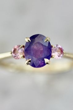 CROWD PLEASER PURPLE OVAL CUT OPALESCENT SAPPHIRE RING | at Gem Breakfast Oval Pink Sapphire Ring With Center Stone, Oval Pink Sapphire Wedding Ring, Oval Pink Sapphire Ring For Anniversary, Oval Sapphire Gemstone With Multi-stone Detail, Oval Multi-stone Sapphire Gemstones, Oval Sapphire Multi-stone Gemstones, Oval Multi-stone Gemstones For Promise Rings, Oval Sapphire Ring With Gemstone Accents, Ethical Sapphire Oval Ring For Promise