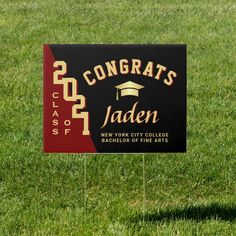 a graduation yard sign in the grass