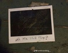 an old polaroid with writing on it that says do you see him?