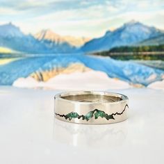 Glacier National Park Mountain Inlay Ring inspired by one of the most breathtaking places in the world. This handmade custom ring contains crushed gemstone(s) of your choice that is inlayed into the summit of mountains outlining Lake McDonald.  If you happen to have some summit rock from your hike at Glacier National  to Mt. Rainier's peak, I can inlay that into your ring!  Contact me for details and questions.  Each ring is individually handcrafted by Michelle Lenáe using recycled precious meta Glacier Jewelry, Young In The Mountains Ring, Silver Mountain Ring, Glacier National Park Lake Mcdonald, Glacier National Park Wedding Elopements, Mountain Ring, Lake Mcdonald, Mountain Jewelry, Montana Wedding