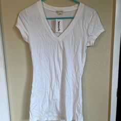 Plain White Tee Long, Slim Fit Zenana Outfitters Size Medium, But Slim Fit Makes It Feel More Like A Small To Me Purchased At Tj Maxx, New With Tags Fitted V-neck Casual Shirt, Basic V-neck Summer Shirt, Casual Fitted V-neck Shirt, Cheap High Stretch White T-shirt, Grey Lace Shorts, White Stretch V-neck Shirt, White Slim Fit Cotton T-shirt, Hot Pink Shorts, Distressed Tee