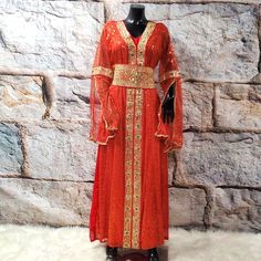 Luxurious Red And Gold Embroidered Long Bat Sleeves Abaya/Party/Gala/Lined Dress. V Neck. Comes With An Embroidered Belt. Lenght: 56 Inches Sleeves :30 Inches Chest :40 Inches Hips: 50 Red Kaftan With Dupatta For Festivals, Red Kaftan With Zari Work For Festivals, Red Traditional Drape Kaftan For Party, Red Anarkali Kaftan For Festive Occasions, Red Festive Kaftan With Zari Work, Festive Red Kaftan With Zari Work, Red Zari Work Kaftan For Eid, Red Dabka Work Kaftan For Eid, Elegant Red Kaftan With Zari Work