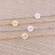 So pretty and delicate! Personalize the dainty disk with a hand stamped initial or meaningful symbol (heart). Layer this with other bracelets for the perfect look. Great gift idea for Bridesmaid, Birthday, and all meaningful days. This bracelet comes with an adjustable extender chain that has a tiny cute teardrop charm hanging at the end of the chain. ** Please be sure to LEAVE your desired initial at check out. Maximum 10 letters or numbers! ** Stamping Letter: 2.5 mm Script or Classic. (see th Dainty Engraved Charm Bracelet, Everyday Round Bracelets With Initials, Minimalist Round Hypoallergenic Charm Bracelet, Minimalist Hypoallergenic Round Charm Bracelet, Hypoallergenic Minimalist Charm Bracelet, Personalized Dainty Charm Bracelet, Dainty Adjustable Name Bracelet With Initials, Dainty Personalized Charm Bracelet, Dainty Adjustable Bracelet With Initials