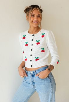 The Sweet Cherry Pie Cardigan features a light weight textured knit fabrication with cherry, button down front and semi cropped length. Goes perfectly pair with denim, over dresses and as a layering piece. Color: Ivory/Red Textured Knit With Cherry Applique Button Down Front Long Sleeve Acrylic Blend Model Wearing Is Wearing Sizes Medium and is 5'4, 32B Bust One Size Fits Most Cherry Cardigan, Sweet Cherry Pie, Fitted Cardigan, Classic Cardigan, Cherry Print, Cherry Pie, White Cardigan, Cardigan Sweaters For Women, Sweater Sale