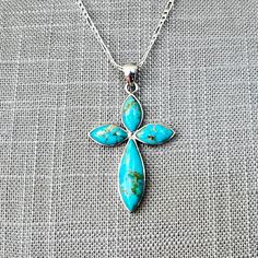 Metal Type: Sterling Silver Hallmarks: 925, Thailand, NK,  Metal Finish: Polish, Natural Patina Item Weight: 7.30 grams Clasp: Tear Drop Lobster Chain Type: Figaro Gemstone: Turquoise Shape: Marquise Setting: Bezel Total: 4 Measurements:  Length 16 1/4", Width 2.46mm, Pendant 1 7/8" x 1 1/8" Condition: Excellent, Like-new condition, with almost no visible wear. **All photos are professionally photographed in our in-house studio, and are of the exact item you will receive.** **All measurements pr Handmade Turquoise Cross Pendant Necklace, Spiritual Hallmarked Turquoise Jewelry, Spiritual Turquoise Jewelry With Hallmark, Hallmarked Turquoise Sterling Silver Necklace, Turquoise Sterling Silver Cross Pendant Jewelry, Turquoise Sterling Silver Cross Pendant, Turquoise Cross Necklace In Sterling Silver, Turquoise Sterling Silver Cross Necklace, Turquoise Cross Sterling Silver Necklace