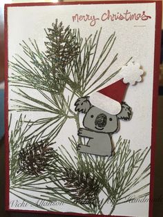 a handmade christmas card with a koala bear