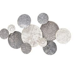 a group of coins sitting on top of each other in front of a white background