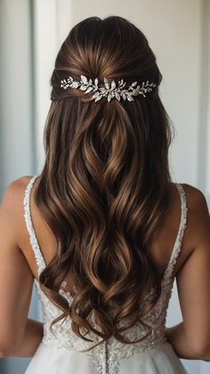 the back of a woman's head wearing a bridal hair comb