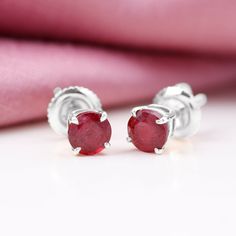 Product Details Add a touch of dazzle to your style with our Solitaire Stud Earrings, featuring a 5 MM Round Shape Created Ruby Solitaire that is sure to complement your look perfectly. These earrings are the perfect way to add a pop of color and sophistication to any outfit, making them a must-have addition to your jewelry collection. Product Information SKU SHP-EARRINGS112031152 Length 5 mm Width 5 mm Weight 0.96 gm (Approximate) LAB CREATED RUBY INFORMATION No.of Stones 2 Pieces Total Weight Solitaire Studs, Round Shape, Prong Setting, Lab Grown, Women's Earrings, Jewelry Collection, Color Pop, Ruby, Lab