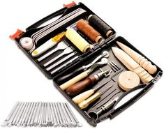 an assortment of kitchen utensils in a black case with wooden spoons and forks