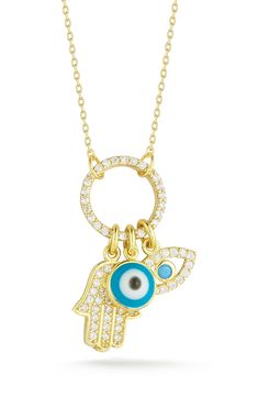 Go boho with this sparkly CZ embellished pendant necklace featuring dainty hamsa and evil eye charms. 18" length; 1"L x 0.5"W pendant Clasp closure Sterling silver or gold plated sterling silver/cubic zirconia Made in Turkey Turkey Glaze, Evil Eye Hamsa, Hamsa Charm, Cz Jewelry, Charm Pendant Necklace, Evil Eye Pendant, Evil Eye Charm, Gold Plated Sterling Silver, Evil Eye