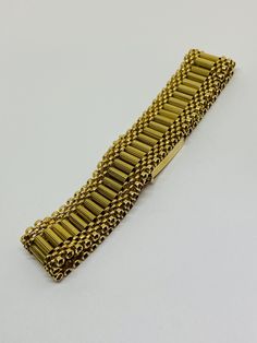 "This is a beautiful, vintage 14K yellow gold bracelet. Material(s) 14K yellow gold Measurements: This bracelet measures 7 inches in length and 14.3 millimeters in width. Weight: 24.6 grams Markings: \"14K\" If you have any questions about this bracelet, please do not hesitate to contact us! ♥" Antique Gold Bracelet Stamped 14k, Antique 14k Stamped Gold Bracelet, Classic Gold Band Bracelet, Formal Yellow Gold Bracelet With Decorative Band, Heirloom Yellow Gold Bracelets With Decorative Band, Gold Jubilee Bracelet Band, Rectangular Gold Bracelet With 17 Jewels, Heirloom Yellow Gold Chain Bracelet, Heirloom Gold Jubilee Bracelet