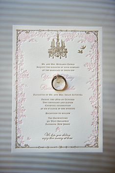 a wedding card with a ring on it