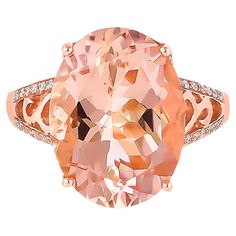 an oval cut peach morganite and diamond ring