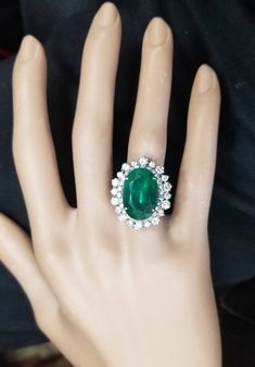 Gorgeous 14k white gold natural green emerald ring center natural emerald Oval cut weight 10.25ct. Size 17x11.5 gorgeous color nice luster ,nice cut,medium dark green color side diamonds total weight 2.50ct. H-SI1 ring size 6.5 Retail value $19,500 net . Appraisal available https://www.instagram.com/p/CAqlczTFXV0/?igshid=zhl7j3sdfhlt Exquisite Oval Green Emerald Ring, Exquisite Green Oval Emerald Ring, Exquisite Green Oval Diamond Ring, Vintage Platinum Rings, Green Emerald Ring, Dark Green Color, Platinum Ring, 14k White Gold Ring, White Gold Ring