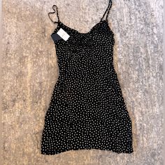 Cute Black And White Polka Dot Mini Dress. Spaghetti Straps And A Silky Material. Zipper Fastener And Button Detailing Down The Front. Never Been Worn, Tags Still On Polka Dot Mini Sundress For Spring, Polka Dot Spaghetti Strap Dress For Brunch, Summer Dress With Polka Dot And Spaghetti Straps, Polka Dot Fitted Sundress, Fitted Polka Dot Sundress, Fitted Polka Dot Sundress For Summer, Cute Polka Dot Mini Dress, Polka Dot Summer Dress With Spaghetti Straps, Fitted Polka Dot Dress With Spaghetti Straps