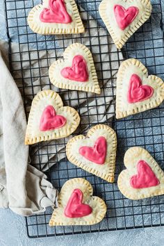 heart shaped pastries on a cooling rack