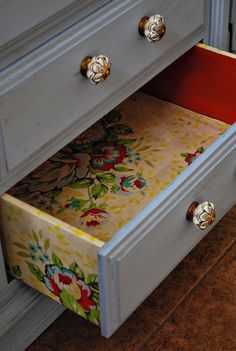 the drawers are painted with floral designs