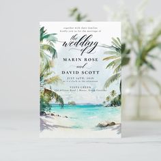 a wedding card with watercolor palm trees on the beach