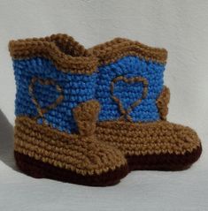 "100% acrylic cowboy/cowgirl baby booties. This pair is in blue, warm brown with a dark brown sole.  Booties are made to order, so please consider production, shipping and handling times when planning your purchase. All booties come gift tagged with size and care instructions. Machine wash and tumble dry. The measurements are: 0-3 months size the sole is 3.5\" long. 3-6 months size the sole is 4\" long. 6-9 months size the sole is 4.5\" long. 9-12 months size the sole is 5\" long. Other colors o Cowboy Boots With Spurs, Boots With Spurs, Crochet Cowboy Boots, Crocheted Baby Booties, Cowgirl Baby, Nevada City, Crochet Baby Booties, Cowboy Cowgirl, Crib Shoes