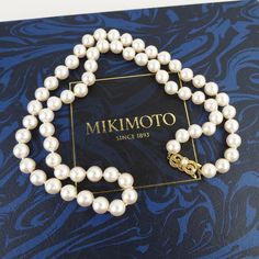 Mikimoto made this wonderful vintage Akoya pearl long 24-inch matinee necklace with their 18k yellow gold signature clasp. There are 23 inches of knotted 8mm to 8.4mm pearls, which are a large size in the world of Mikimoto. Mikimoto is known for the finest quality of cultured pearls and exceptional jewelry design. The akoya pearl is a saltwater cultured pearl from the akoya oyster (Pinctada fucata martensii) known for its perfect round shapes, bright mirror-like luster and neutral colors. These particular pearls are a creamy white color with a slight rose tone. They are highly reflective with a thick nacre, slight surface blemishes and very good uniform roundness. The fancy engraved bow-shaped clasp has a 3.6mm pearl on top. The back of the clasp is marked with an "M" inside of a shell sha Classic Gold Single Strand Pearl Necklace, Classic Yellow Gold Pearl Necklaces, Classic Yellow Gold Pearl Necklace, Classic Akoya Pearl Necklace For Gift, Classic Akoya Pearl Necklaces For Anniversary, Vintage Akoya Pearl Necklace For Formal Occasions, Classic Gold Pearl Necklace, Formal Vintage Akoya Pearl Necklace, Vintage Akoya Pearl Drop Necklace