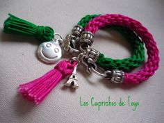 two bracelets with charms attached to them on a white tablecloth background and the words la capricchio de lyge written in spanish