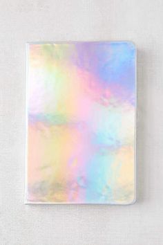 a pastel colored square shaped object on a white surface