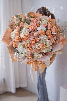 a bouquet of pink and white flowers in a vase