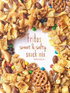 a white plate topped with cereal and pretzel snack mix next to an orange sign that says fritos sweet & safty snack mix