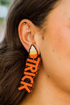 Enhance your Halloween look with these earrings! Delicately adorned with black, white, yellow, and orange seed beads, these earrings add a touch of spooky sophistication! The dangle design and secure post backs make them a comfortable and stylish accessory for any festive occasion! Black White Yellow, Halloween Looks, Boyfriend Tee, Stylish Accessories, Trick Or Treat, Seed Beads, Black White, Festival, Beads