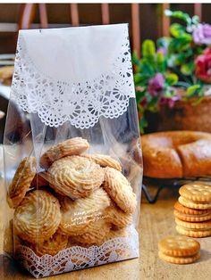 a bag full of cookies sitting on top of a wooden table