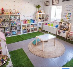 a child's playroom with toys and bookshelves