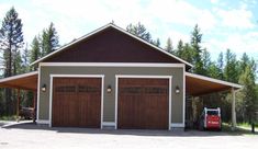 two garages with one car parked in the driveway