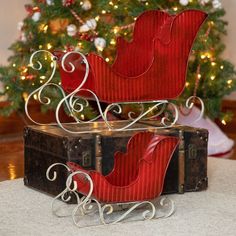 "Back by request, our Set of 2 Victorian Style Red Iron Sleighs is a timeless decoration, sure to last season after season. With their sleek, simple and sturdy design, these sleighs are both elegant and functional. Use alone, fill with ornaments or lights, or get creative and use as a planter or to display something else. *Santa not included - Indoor/Outdoor safe - Powder coated iron - Hand painted, distressed finish - Antique style - Rigged texture and rustic details   Product Dimensions & Spec Christmas Sleighs, Dragon Garden, Lawn Art, Bird Bath Garden, Iron Hand, Metal Christmas, Christmas Sleigh, Old Fashioned Christmas, Outdoor Christmas Decorations