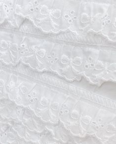 white lace fabric with flowers and leaves on it