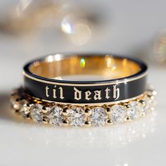 A piece to honor those in your life whose love lasts forever, the Til Death band is perfect for stacking or wearing solo. Due to the width of this band, we recommend sizing a half size up, especially when stacking. This piece is part of our Til Death collection. Shop the collection here. Available in 18k gold Contact us for pricing. Black And Gold Wedding Dresses, Black And Gold Wedding Rings, Goth Marriage Ring, 3 Stacked Wedding Rings, Black And Gold Wedding Dress, Black And Gold Wedding Band, Goth Wedding Rings Matching, Round Solitaire Wedding Set, Gothic Weddkng Rings