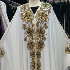 Luxurious Abaya Dress. Superior Quality. Limites Edition. Satisfied Or Reimbursed White Floor-length Abaya, Elegant White Long Sleeve Abaya, White Floor-length Abaya For Eid, White Maxi Length Thobe For Party, White Embellished Traditional Kaftan, Traditional White Embellished Kaftan, Elegant White Kaftan For Eid, White Dabka Dress For Party, White Embellished Long Dresses