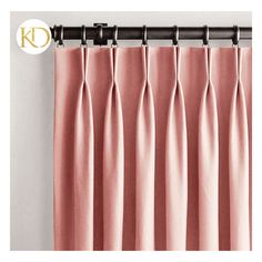 pink curtains hanging on a curtain rod in front of a white wall with the letter k