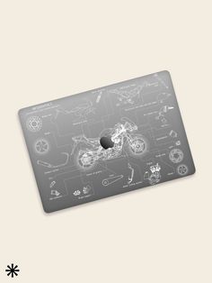 an apple mouse pad with a drawing of a motorcycle on the front and back side