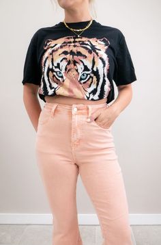 a woman dressed in a stylish graphic tee with high-waist denim flare pants Graphic Print T-shirt With 3/4 Sleeves, Tiger Graphic Tee, Gold Layered Necklaces, Tee Outfits, T Shirt Outfit, Tiger Graphic, Graphic Tee Outfits, Causal Outfits, Tiger T Shirt