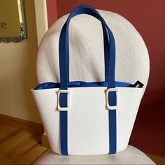 Ioaiiio Made In Italy Icona White Royal Blue Bucket Bag. Super Cute And Rare Italian Bag Made In A Unique Way. You Can Change The Straps, The Lining Since Everything Is Detachable. A Cool Concept Like Lego :) Lightweight And Durable Foam Material All Original Tags Attached Minor Scratches Right Above The Logo. See Last Picture Modern White Shoulder Bag For Vacation, Modern White Bags For The Beach, Modern White Bags For Beach, Elegant Blue Shoulder Bag For The Beach, Modern White Beach Bag, Blue Bucket-shape Shoulder Bag For Daily Use, White Bucket Bag With Detachable Strap For Vacation, Blue Bucket Shoulder Bag For Daily Use, White Vacation Bucket Bag With Detachable Strap