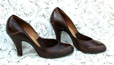 Original and not remakes, this is a pair of authentic 1940's brown leather pumps.   Of course, there is no size. I measured them from the inside and got approx. 9 1/4 inches. Please measure a pair od shoes that fit you well and compare to my measurements. The heels were measured from the back and are 3 inches. These are 3 inches wide. The insides say "Onco Insole  _____ated. You might want to add insoles.  Please see the photos. These are sturdy and very wearable.   Look at the little metal ring Fashion Boards, Pumps Shoes, Metal Ring, Leather Pumps, Metal Rings, Pump Shoes, Style Board, Brown Leather, Pumps