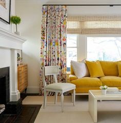 a living room filled with furniture and a fire place