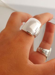 Wide Silver Ring, Statement Ring, Sterling Silver, Wide Dome Ring, Wide Band Ring, Modernist Ring, Chunky Dome Ring, Full Finger Ring Modern and Chic in Design, this Statement Dome Ring is stunning. Perfect on it's own and just may be the only ring you need. 100% Handmade   100%  Sterling Silver  Width 18.2 mm  Length 25.0 mm Weight 18.0  grams (Weight may vary by size) Μade to order  Free shipping Tracking number  Elegant gift box and gift bag Accepted return for resizing  Acceptable return for Full Finger Ring, Moon Shine, Full Finger Rings, Wide Silver Ring, Modernist Ring, Wide Band Ring, Dome Ring, Wide Band Rings, Domed Ring